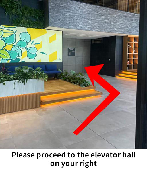 Please proceed to the elevator hall on your right